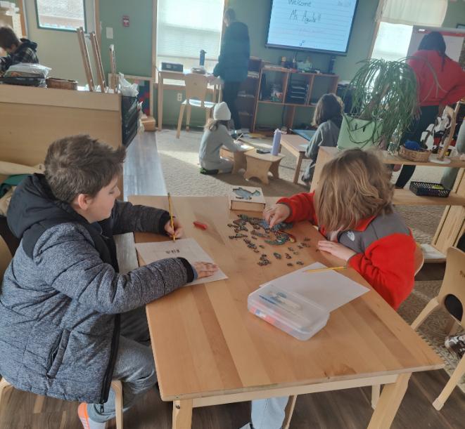 Elementary students working with hands-on materials