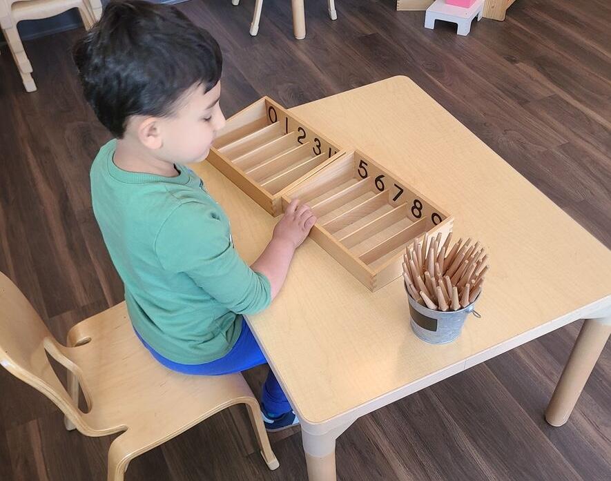 Primary students in a Montessori classroom