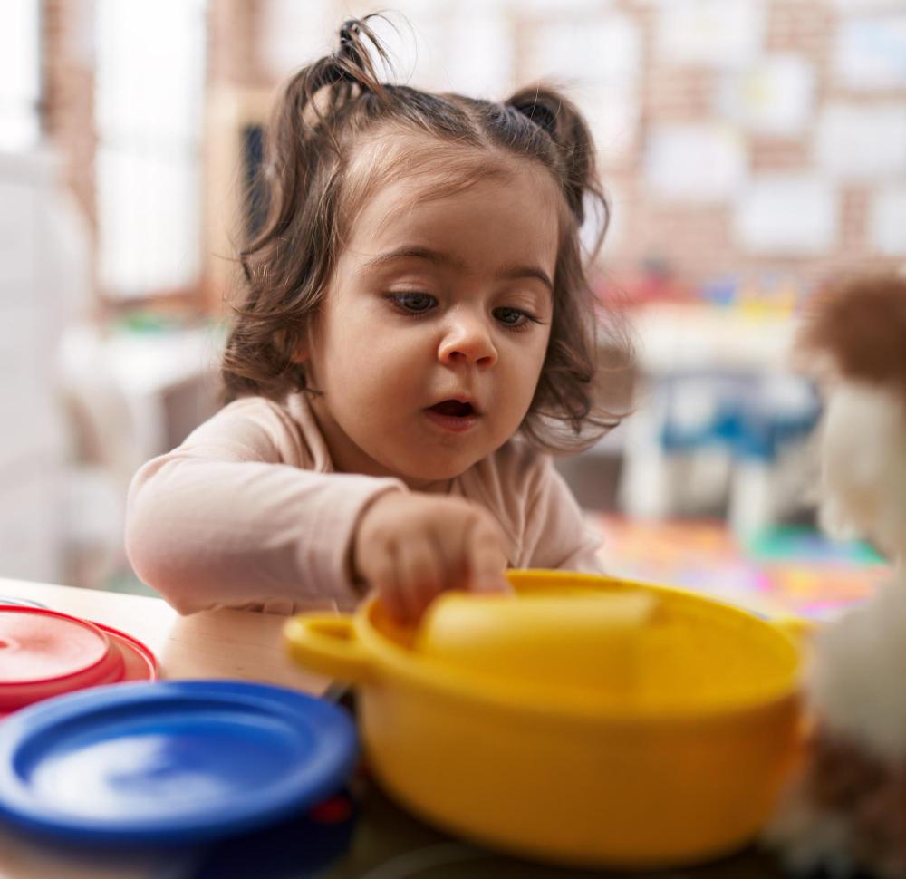 Toddler engaging with learning materials
