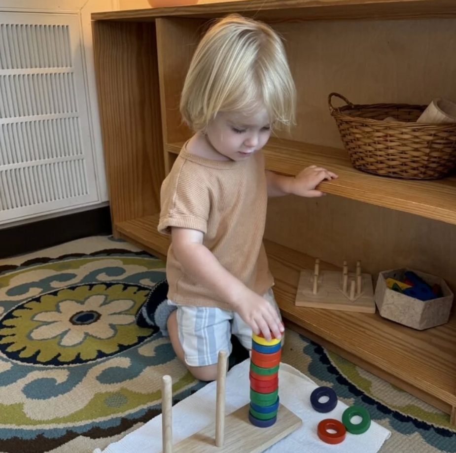 Baby exploring Montessori materials